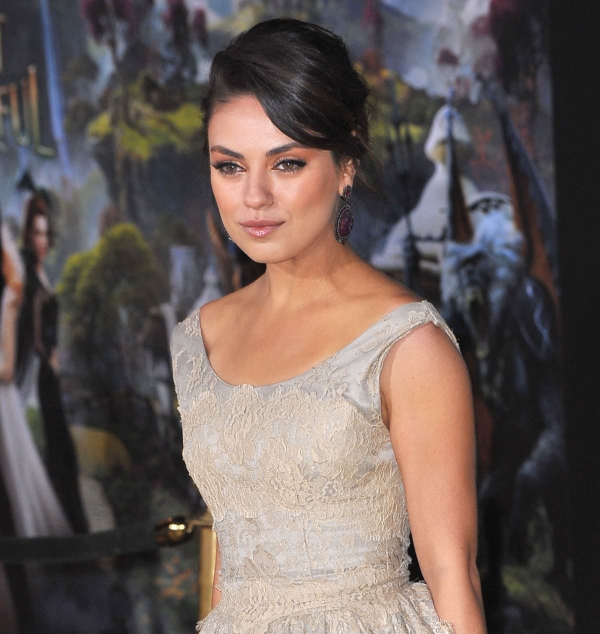 Mila Kunis styled her dress with violet Sutra earrings