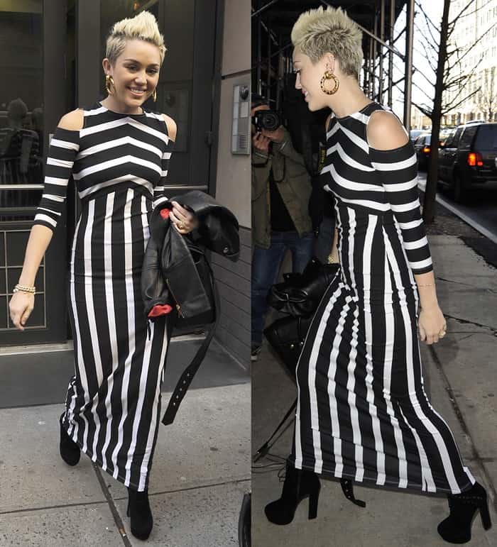 Miley Cyrus outside an office building in Manhattan wearing a form-fitting black and white dress