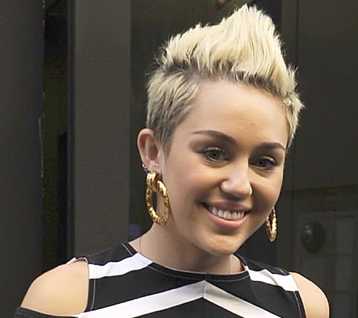 Miley Cyrus shows off her Chanel cut-out circle earrings