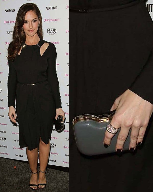 Minka Kelly toted a black Fendi Giano clutch at the Vanity Fair and Juicy Couture Celebration of the 2013 Vanities Calendar