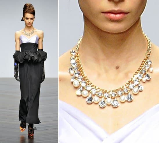 A model wears a pearl and crystal drop necklace on the runway at PPQ's Spring/ Summer 2013 fashion show