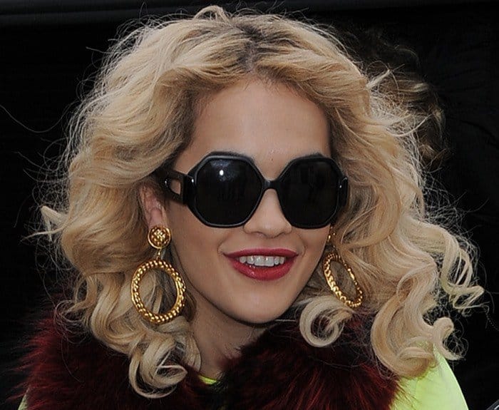 Rita Ora shows off her chunky gold earrings
