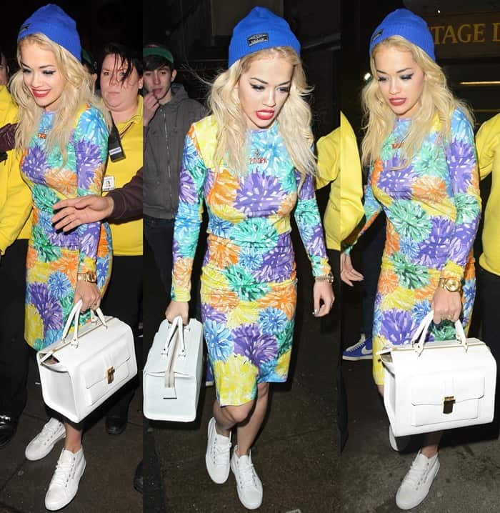 Rita Ora dazzles in a vivid Henry Holland pompom-print cotton dress as she exits Shepherd’s Bush Empire, London, adding a splash of color to the winter evening on February 5, 2013