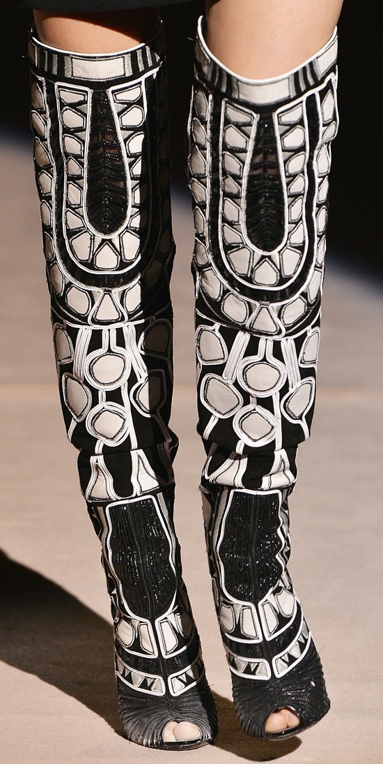 Model wearing black-and-white graphic boots