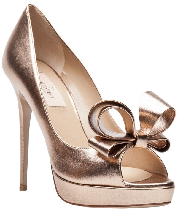 Make a statement of elegance with these gorgeous peep-toe pumps by Valentino