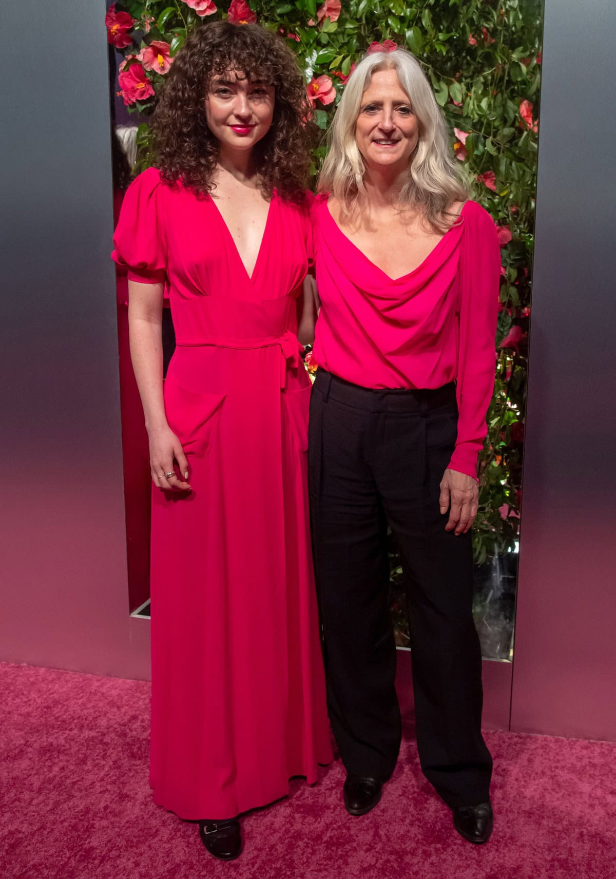 Violet Savage and Nanette Lepore coordinated in bold pink ensembles and sleek black footwear at the KitchenAid Color of the Year Collection presentation during New York Fashion Week Fall/Winter 2023 at IRON23 on February 9, 2023