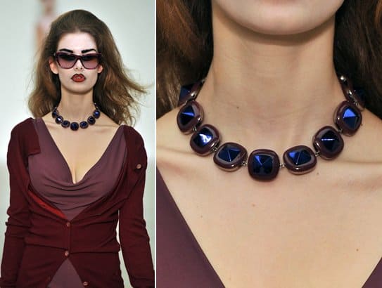 A model wears a blue crystal link necklace