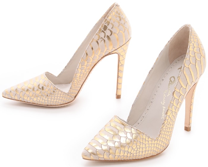 Metallic highlights touch the snake-embossed pattern on these beige nubuck alice + olivia pumps, lending a rock-n-roll edge to the sexy silhouette