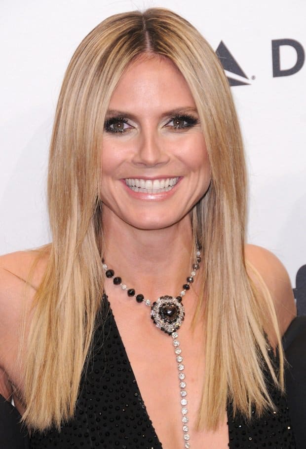Heidi Klum shows how to wear a Y-necklace with a deep plunging neckline dress