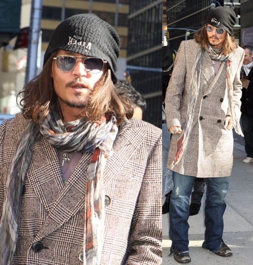 Johnny Depp showcased a distinctive ensemble at the David Letterman Show on February 21, 2013, featuring a Viper Room beanie, Rrl striped western cowboy snap front shirt, Faliero Sarti tartan scarf, Sancho leather biker boots, Dolce & Gabbana multicolor textured double-breasted trench coat, and Randolph Engineering square pilot sunglasses
