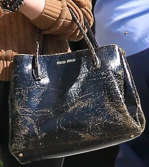Chloë Grace Moretz totes a distressed Miu Miu Craquele Spring 2013 handbag