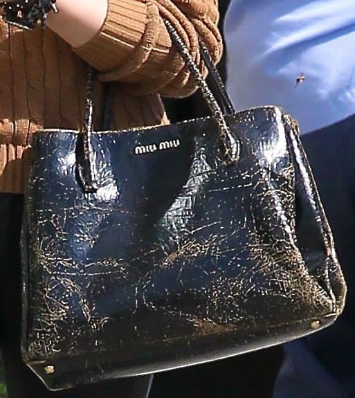 Chloe Moretz totes a distressed Miu Miu Craquele Spring 2013 handbag