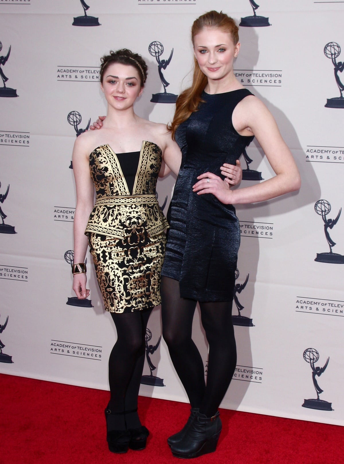 Actresses Maisie Williams and Sophie Turner attend an evening with "Game Of Thrones"