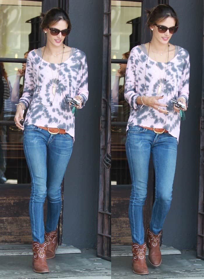 Alessandra Ambrosio styles her tooth-inspired accessory with a Blue Life 'Marteeni' top, Citizens of Humanity jeans, and studded Isabel Marant 'Caleen' boots
