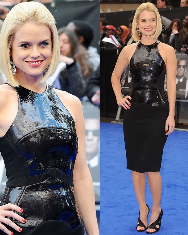 Alice Eve stuns in a sleek black patent leather dress with a peplum detail, perfectly paired with peep-toe heels at the premiere of Men in Black 3