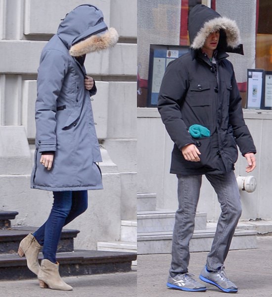 Andrew Garfield and Emma Stone using the hoods of their jackets to hide their faces from waiting photographers while out and about in New York City on March 3, 2013