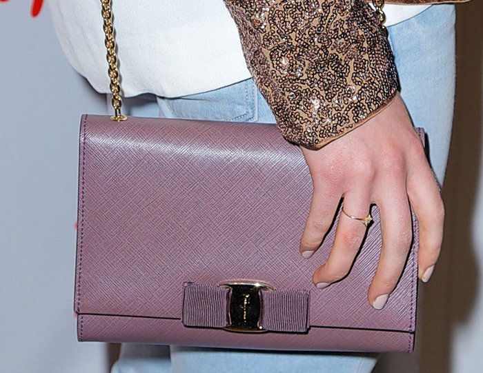 AnnaSophia Robb carries a Salvatore Ferragamo "Vara" bow clutch