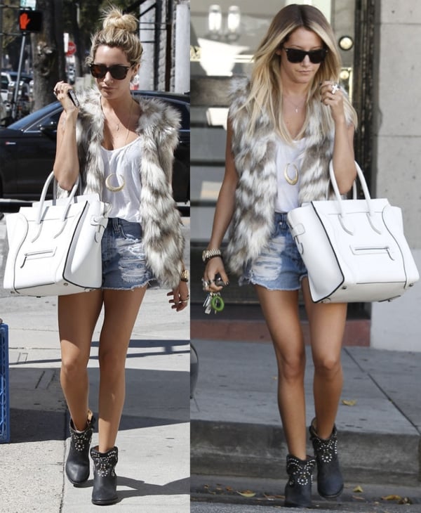 Ashley Tisdale in a pair of Isabel Marant "Caleen" boots, cutoff jean shorts, a white tank, and a fur vest