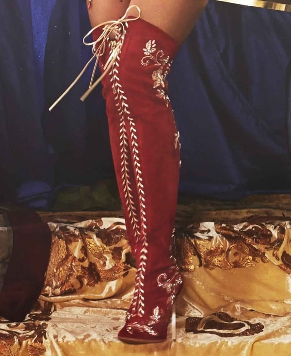 Beyonce wears custom red thigh-high Casadei boots in the promotional materials for the upcoming "The Mrs. Carter Show" tour
