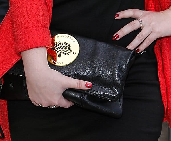 Dani Harmer brings classic elegance to the forefront at the TRIC Awards with her sophisticated Mulberry "Daria" clutch