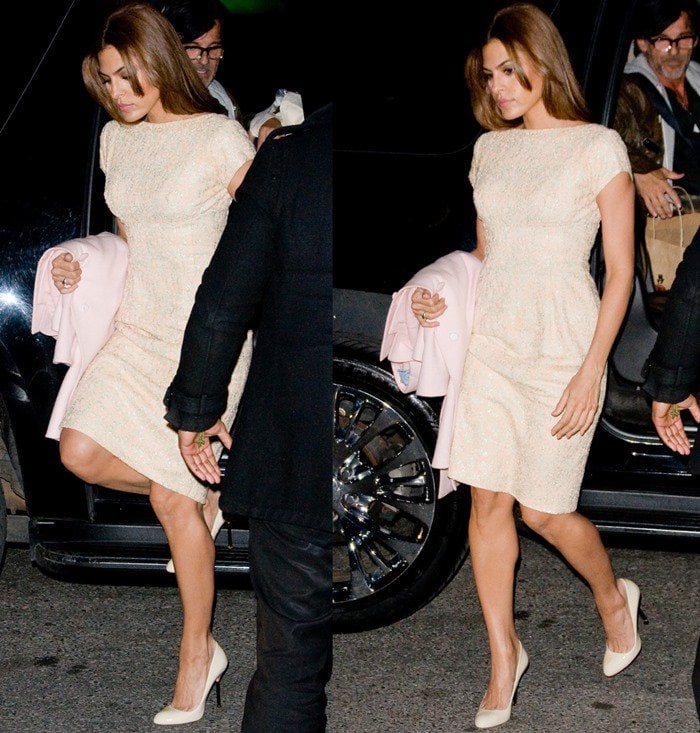 Eva Mendes steps out in Manhattan exuding sophistication in a cream form-fitting dress, paired with polished nude heels and a soft blush coat in hand