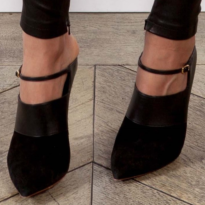 Gwyneth Paltrow's Nicholas Kirkwood mules are made of paneled suede and leather, which mimic the silk and leather pairing of her top and pants