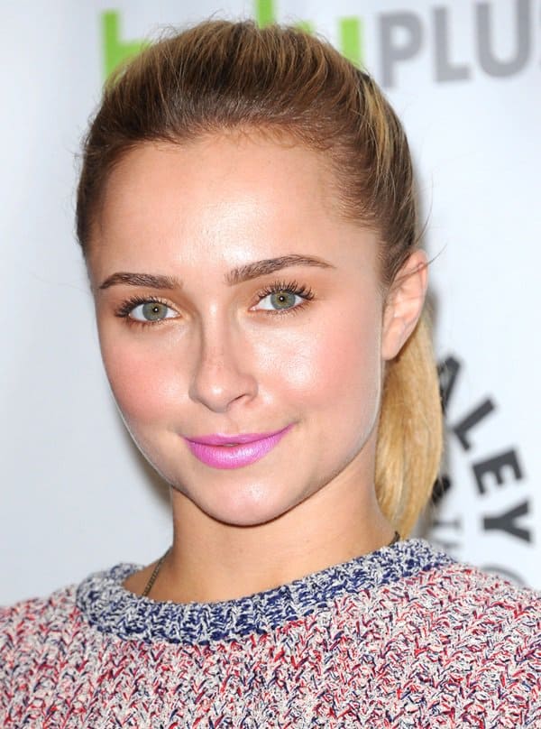 Hayden Panettiere glows with neon pink lips, a high ponytail, and shimmering golden eyeshadow