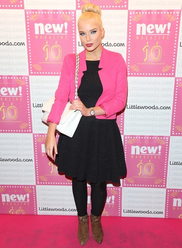 Channeling her inner Barbie, Helen Flanagan pairs a vibrant pink blazer with a sleek black dress, defining party chic