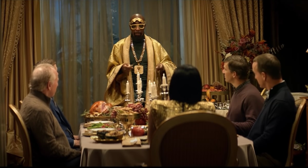 Dad Archie Manning and sons Peyton, Cooper, and Eli are guests at a turkey dinner hosted by Julius Caesar (J.B. Smoove) and Cleopatra (Halle Berry)