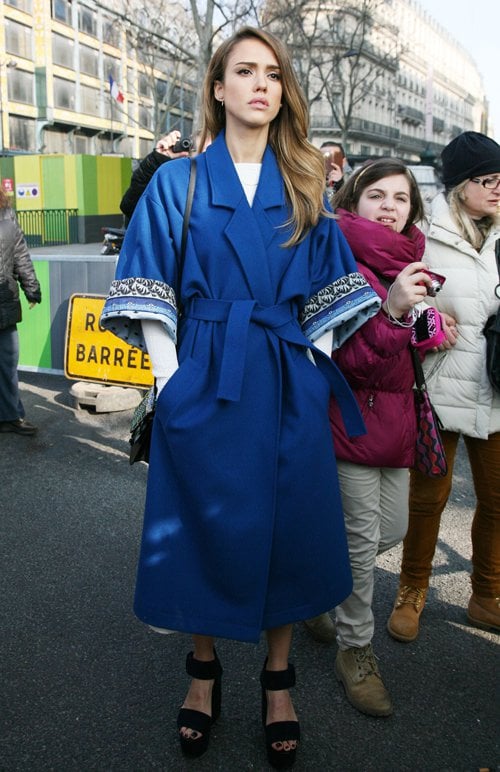 On March 3, 2013, in Paris, Jessica Alba showcased a stylish ensemble featuring a Kenzo wrap coat and black sandals