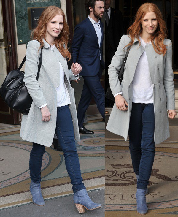 Jessica Chastain wears a dress coat over skinny jeans and a white crew neck while out in Paris