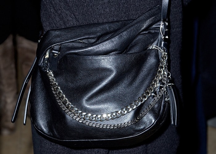 Sarah Jessica Parker completes her edgy look with a black leather biker bag featuring bold chain detailing by Jimmy Choo