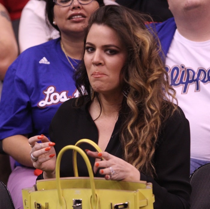 Khloé Kardashian wearing a textured black blazer