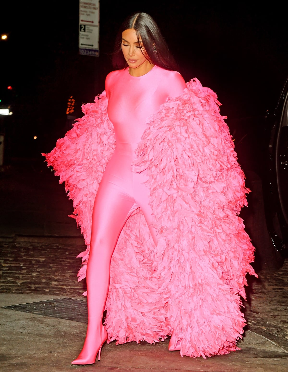 Kim Kardashian's skintight spandex bodysuit features attached pointy-toe heels