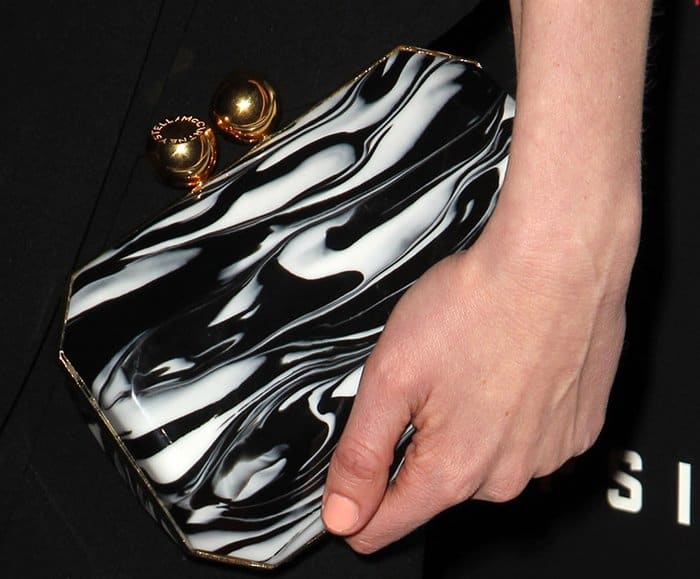 Kirsten Dunst's chic accessory choice: A black and white marble Stella McCartney clutch at the film premiere