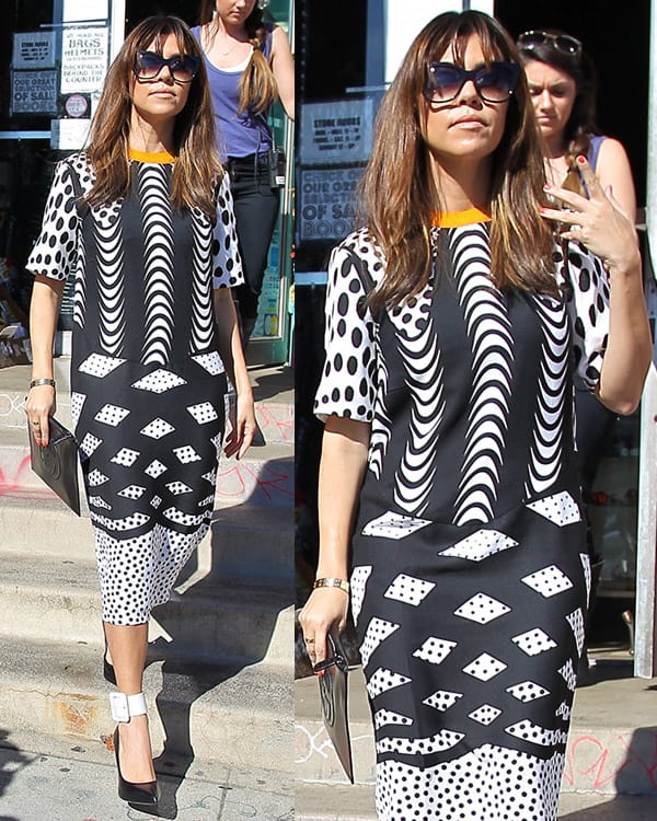 Kourtney Kardashian exuded chic elegance in Los Angeles on March 14, 2013, wearing a bold ASOS monoclash print T-shirt dress paired with Saint Laurent Paris Escarpin pumps and accented by Dita Magnifique sunglasses in black