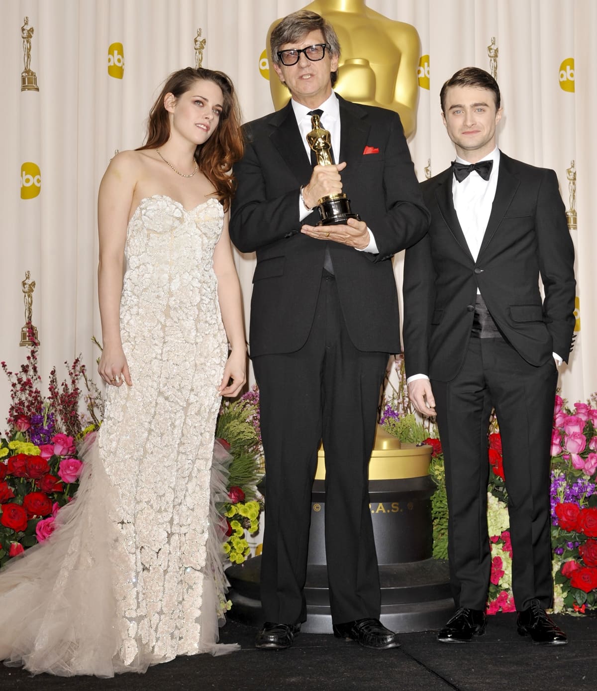 Actress Kristen Stewart, Rick Carter, and Daniel Radcliffe at the 85th Annual Academy Awards Press Room