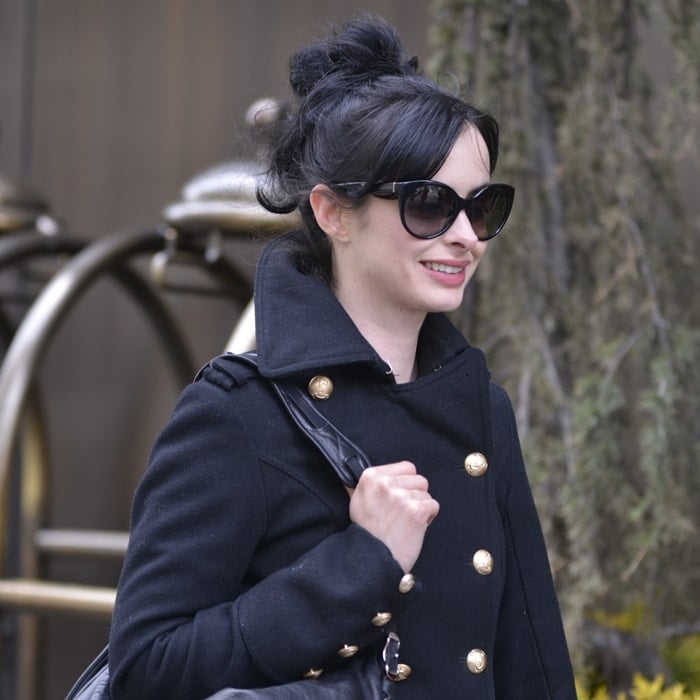 Elegant Krysten Ritter showcasing timeless fashion on a sunny New York day in March 2013