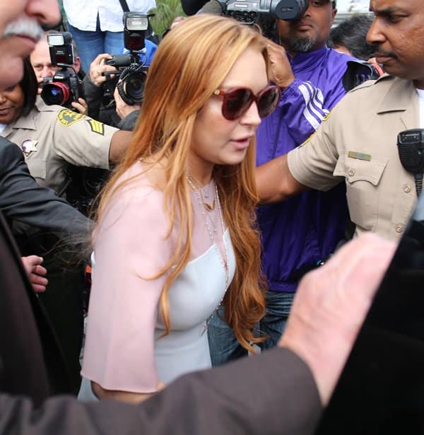 Lindsay Lohan elegantly dressed in a white ensemble from 3.1 Phillip Lim's Fall 2012 collection, making a fashion statement in the courtroom