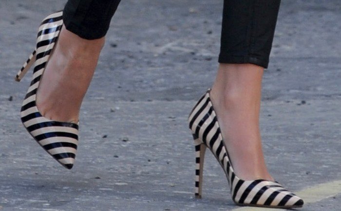 Lydia Bright's feet in striped Dune pumps