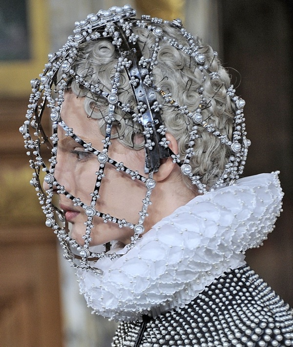 Model wearing a bejeweled headpiece from Alexander McQueen