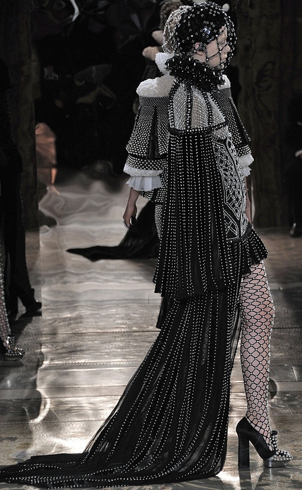 Model wearing a bejeweled headdress at the Alexander McQueen Autumn Winter 2013 fashion show