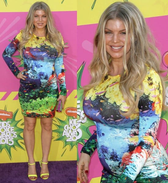 At the Nickelodeon Kids' Choice Awards on March 23, 2013, Fergie dazzled in a Mary Katrantzou fishtank dress, paired with Fergie Roxane sandals in yellow, accented by a Stephen Webster ring, and carrying a Swarovski Power multicolor clutch