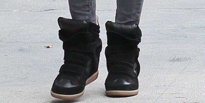 Nicky Hilton wears a pair of black Isabel Marant sneakers