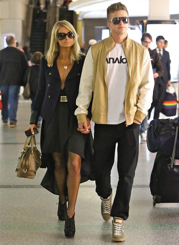 Paris Hilton on her way to catch a long-haul flight to Barcelona with her boyfriend