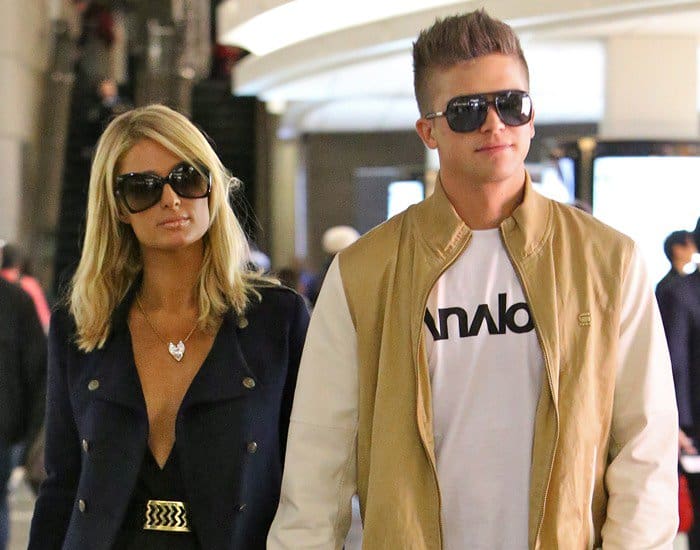 Paris Hilton and boyfriend River Viiperi seen arriving at LAX