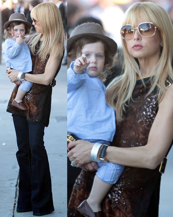 Rachel Zoe wearing flare jeans with a printed sleeveless top