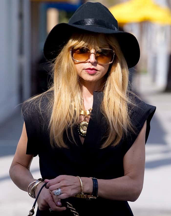 Accenting her monochrome ensemble, Rachel Zoe opts for vintage glam with a bold Givenchy pendant necklace