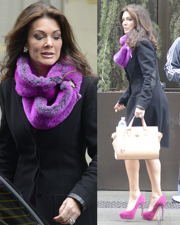 Reality star Lisa Vanderpump in a purple dress and a black coat exiting the Trump Soho Hotel