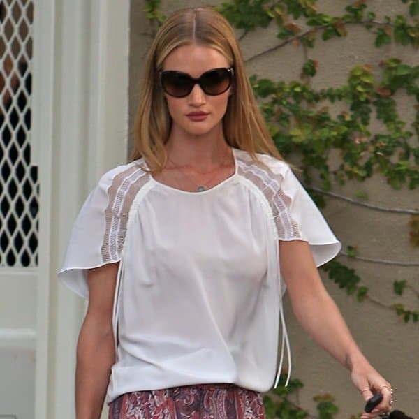 Rosie Huntington-Whiteley spotted post-salon visit, showcasing her immaculate style in a crisp white shirt on Melrose Place, Los Angeles, March 25, 2013